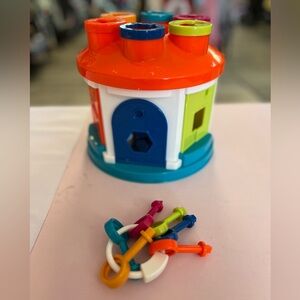 Battat Shape Sorter House, an early learning activity toy.